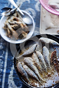 Frying small sardines fish, Chefchouen, Morocco photo