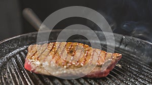 Frying steak in a frying pan