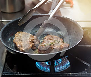 Frying Steak on Pan, Steak in the pan in the Kitchen