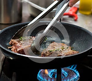 Frying Steak on Pan, Steak in the pan in the Kitchen