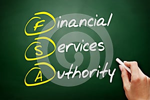 FSA - Financial Services Authority acronym, business concept on blackboard