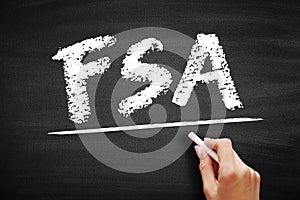 FSA - Financial Services Authority acronym, business concept on blackboard