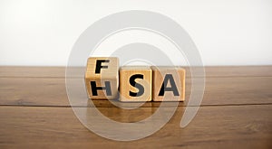 FSA or HSA symbol. Turned a cube and changed the word `FSA - Flexible Spending Account` to `HSA - Health Savings Account`.