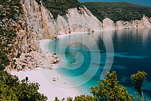 Fteri beach. Blue lagoon with rocky coastline, Kefalonia, Greece. Calm clear blue emerald green turquoise sea water with