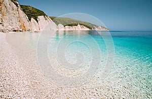 Fteri beach in Kefalonia Island, Greece. Most beautiful beach with pure azure emerald sea water surrounded by high white