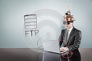 FTP text with vintage businessman using laptop