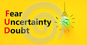 FUD fear uncertainty doubt symbol. Concept words FUD fear uncertainty doubt on yellow paper on a beautiful yellow background.