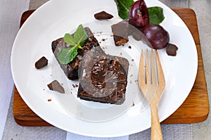 Fudge Brownie Bars on White Plate with Wooden Fork