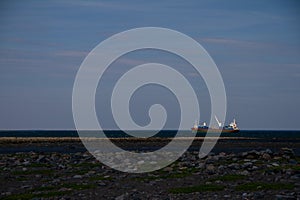 Fuel barge or tanker ship off the coast of Hudson Bay waiting to provide fuel for an arctic community