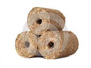 fuel briquettes of straw isolated on a white