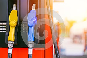 fuel gas station, closeup gasoline fuel nozzle petroleum benzine and diesel or gasohol colors type