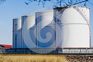 Fuel and lng gas storage tanks at oil terminal.