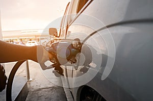 Fuel nozzle to refill fuel in car at gas station