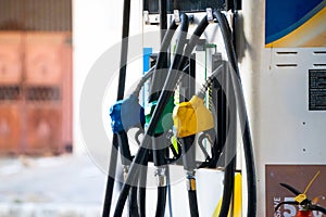 Fuel nozzles for diesel, petrol and speed showing a petrol pump fuel station in India the pricing of which is controlled