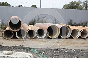 Fuel pipes. Large pipes lie near the fence. Preparation of the oil pipeline. I