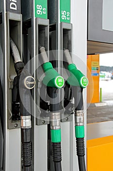 Fuel Pump Nozzles at Filling Station photo