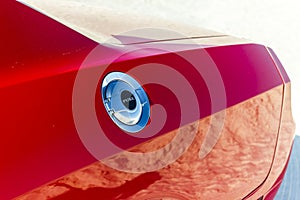 Fuel tank cap of red sports car