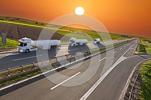 Fuel tank truck in motion blur on the highway at sunset