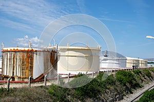 fuel tank and warehouses against the sky photo