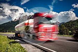 Fuel truck rushes down the highway in the background the Alps. T photo