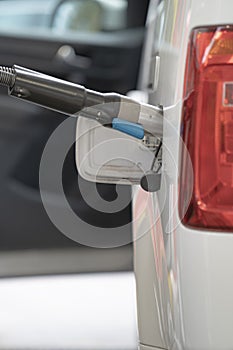 Fuel up the natural gas vehicle NGV at the station. Price increase concept