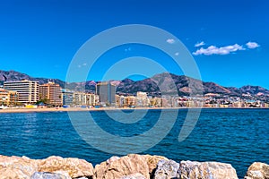 Fuengirola seafront Spain at Playa los Boliches with hotels, apartments, mountains and Mediterranean sea