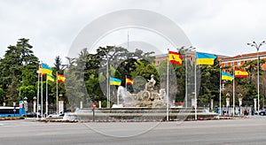Fuente de Cibeles with Spanish and Ukrainian Flags photo