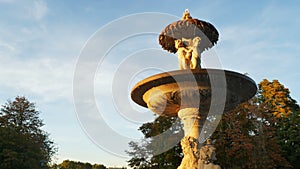 Fuente de la Alcachofa fountain in Retiro Park at sunset in Madrid Spain footage