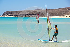 Fuerteventura , Canary island 08 June 2017 : A man is enjoying windsurfing. it is necessary to learn using a surf school