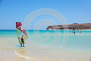 Fuerteventura , Canary island 08 June 2017 : A man is enjoying windsurfing. it is necessary to learn using a surf school