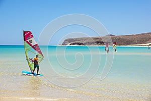 Fuerteventura , Canary island 08 June 2017 : A man is enjoying windsurfing. it is necessary to learn using a surf school