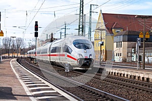ICE 3, intercity-Express train from Deutsche Bahn passes train station
