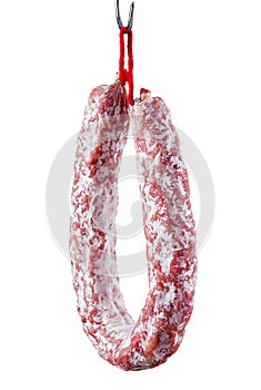 Fuet. Dry sausage with mold isolated on white