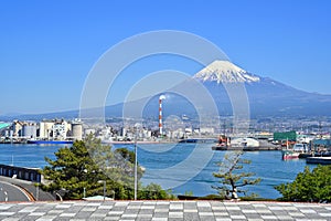 Fuji Mountain and Fisherman boats with Japan industry factory area background view from Tagonoura Fisheries Cooperative cafeteria