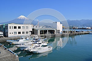 Fuji Mountain and Fisherman boats with Japan industry factory area background view from Tagonoura Fisheries Cooperative cafeteria