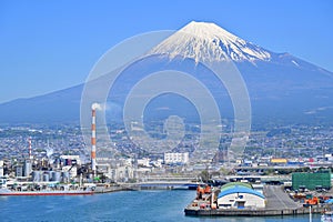 Fuji Mountain and Fisherman boats with Japan industry factory area background view from Tagonoura Fisheries Cooperative cafeteria