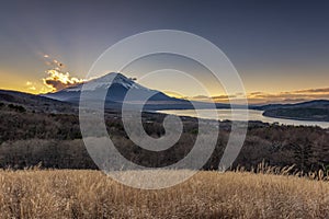 Fuji Mountain with Sun ray on top at Sunset in Autumn, Panoramadai Observation,  Yamanakako Lake, Japan