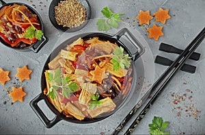 Fuji soy asparagus with vegetables in a black bowl