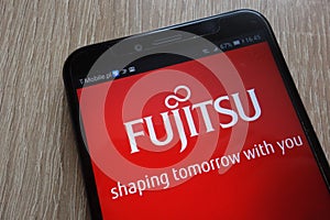 Fujitsu logo displayed on a modern smartphone
