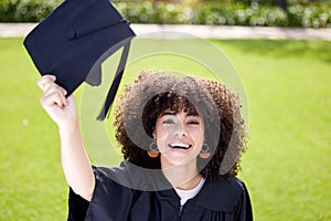 Fulfil your own purpose and potential. Portrait of a young woman holding her cap on graduation day.