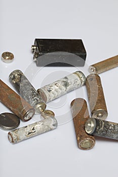 The fulfilled batteries of the different size covered with corrosion. Recycling.