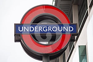 FULHAM, LONDON, ENGLAND- 17 February 2021: UNDERGROUND roundel outside Fulham Broadway tube station