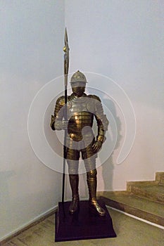 Full armor suit with a halberd in hand