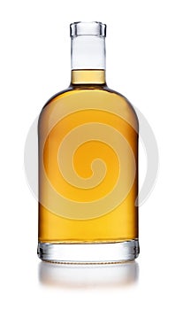 A full bell shaped bottle of golden whisky, with no label or branding, isolated on white