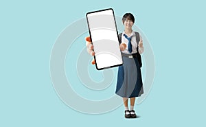 Full body Asian student girl wearing uniform with hand holding big smart phone,