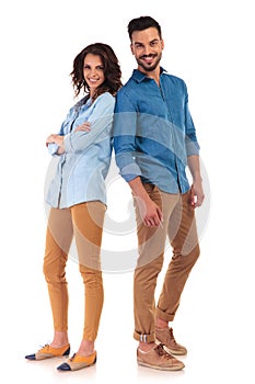 Full body of a casual couple smiling