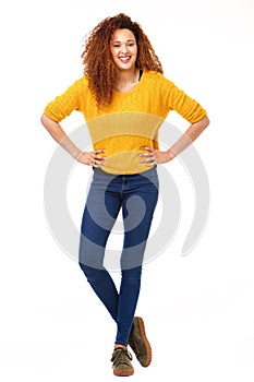 Full body confident happy woman standing against isolated white background