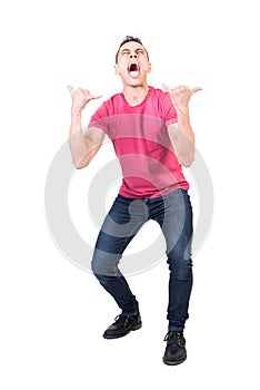 Mad man screaming and showing rock n roll gesture