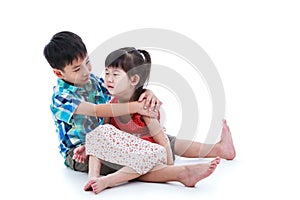 Full body. Elder brother is comforting his crying sister. Isolated on white background. Conceptual about familial love. photo