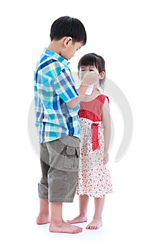 Full body. Elder brother is comforting his crying sister. Isolated on white background. Conceptual about familial love.